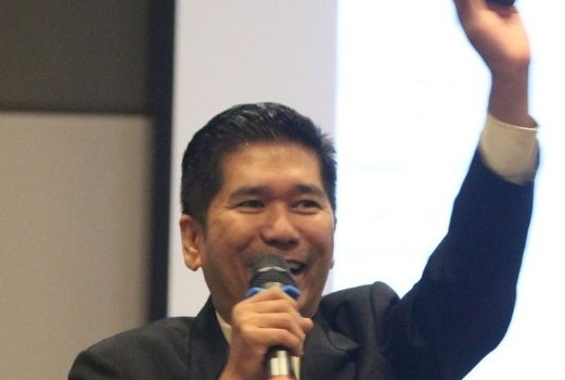 Danny Teo speaking at an event